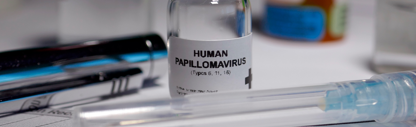 A medicine bottle which reads "Human Papilomavirus"