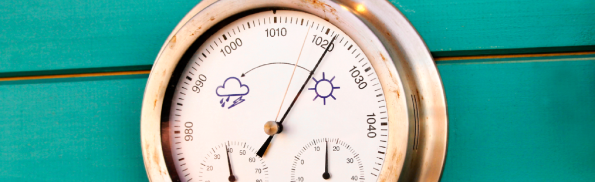 Round barometer with humidity and temperature dials